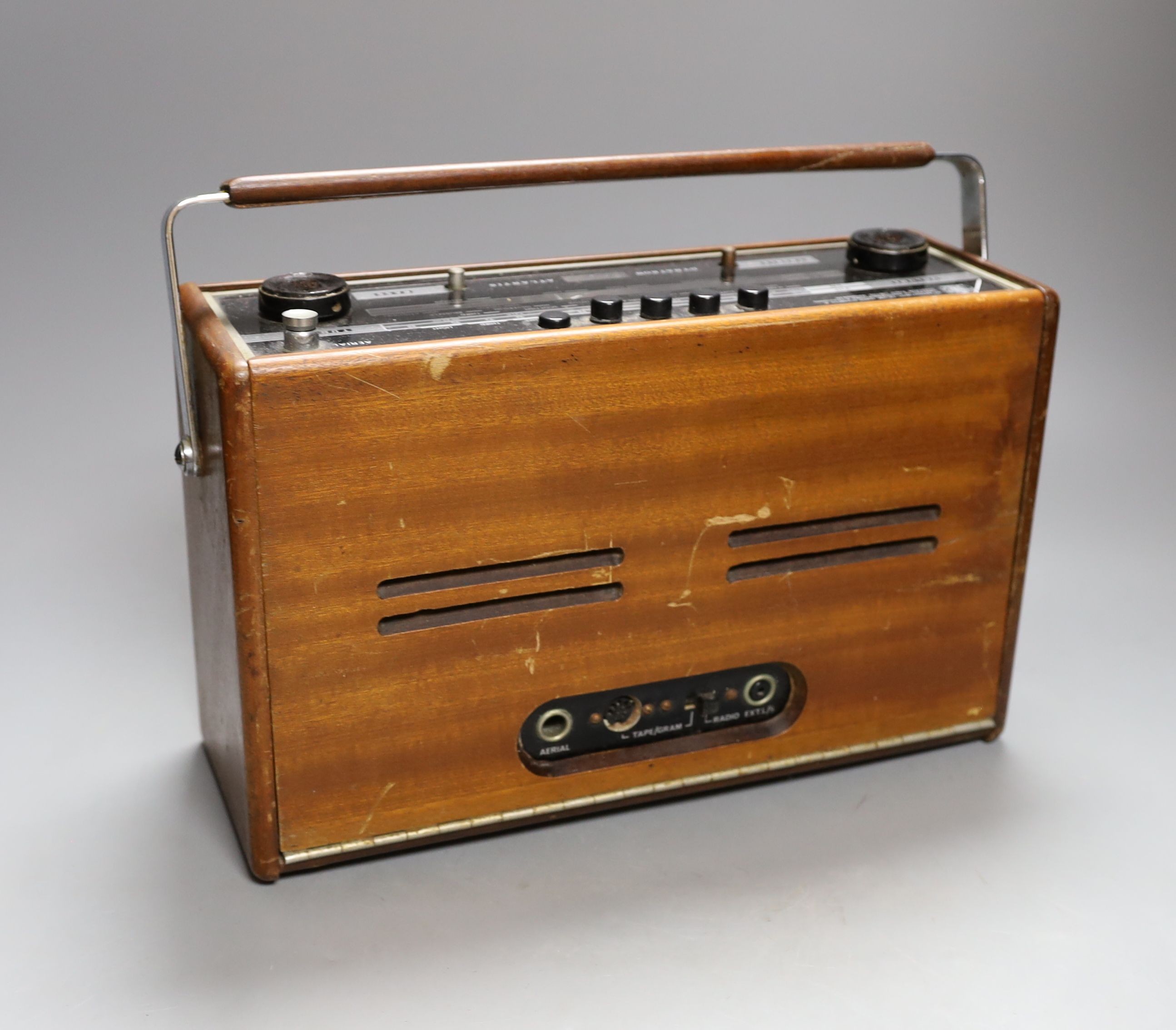 A Dynatron Atlantis portable radio, 33 cms high.